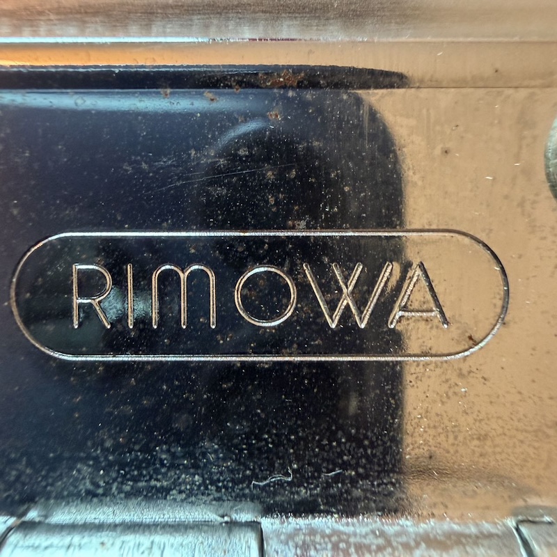 RIMOWA Suitcase — Brand Logo (1)