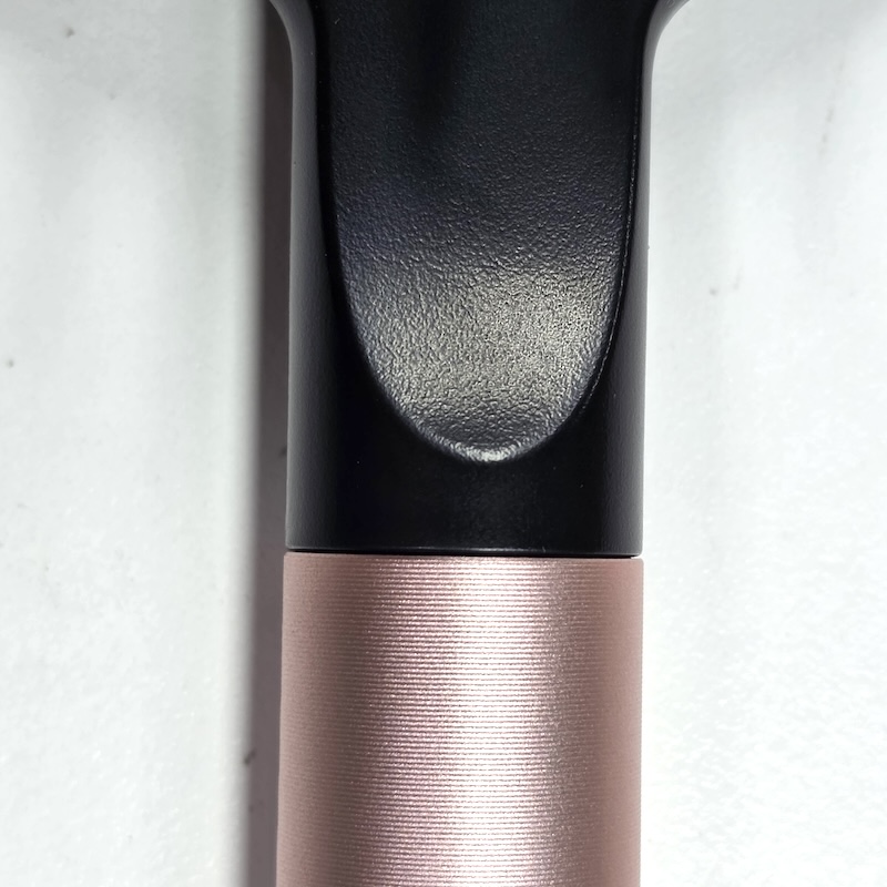 Dyson Cushion Comb — Handle Seam Detail