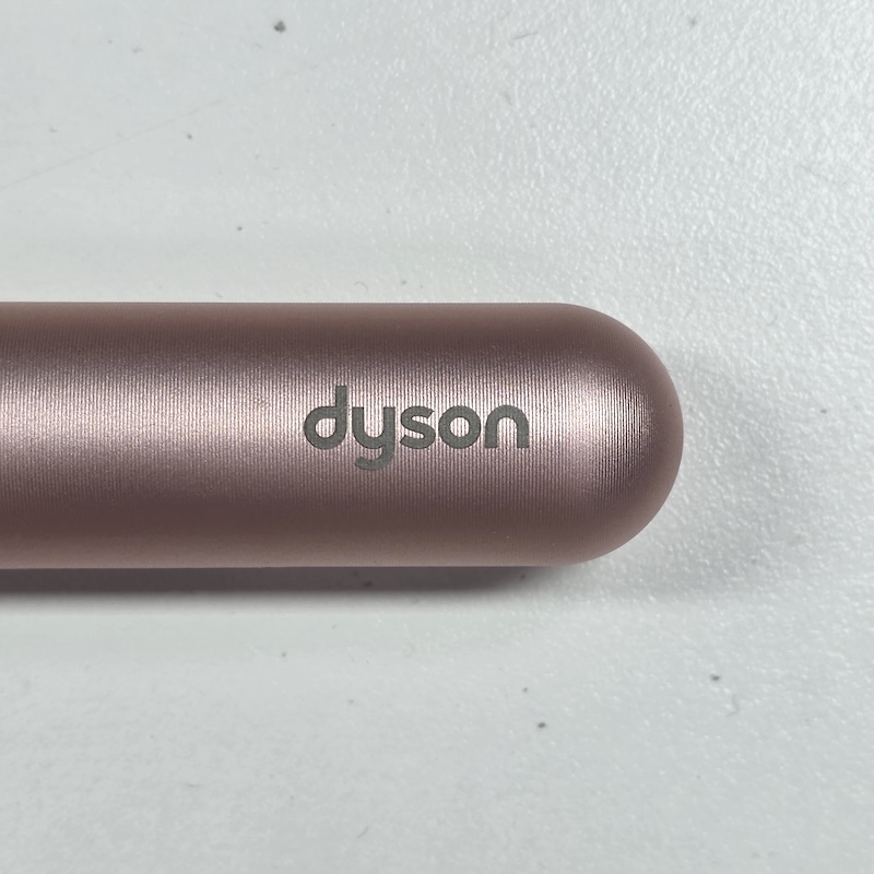 Dyson Cushion Comb — Brand Logo